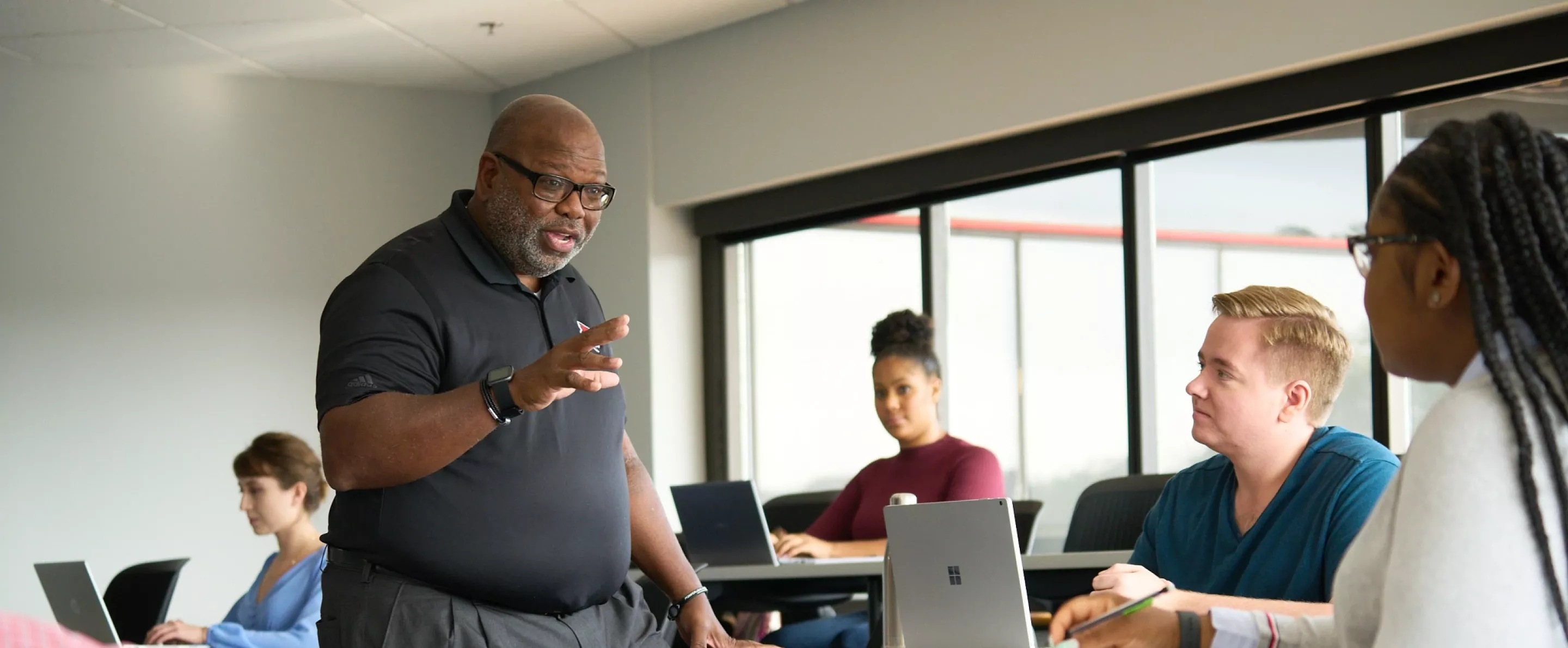 Professor Michael Wade teaching students in the College of Business.
