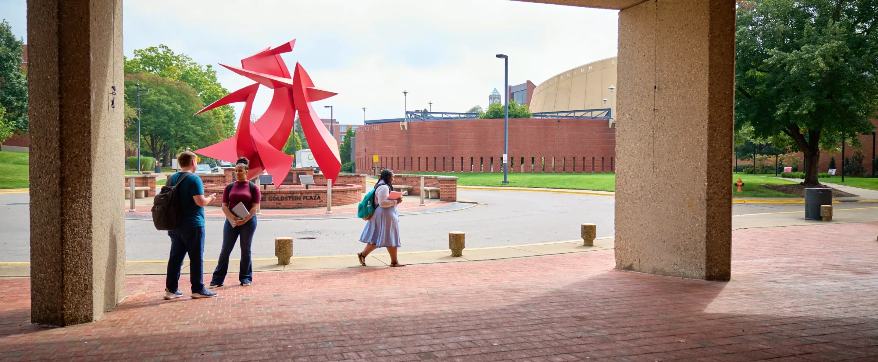 Students in front of the college of business.