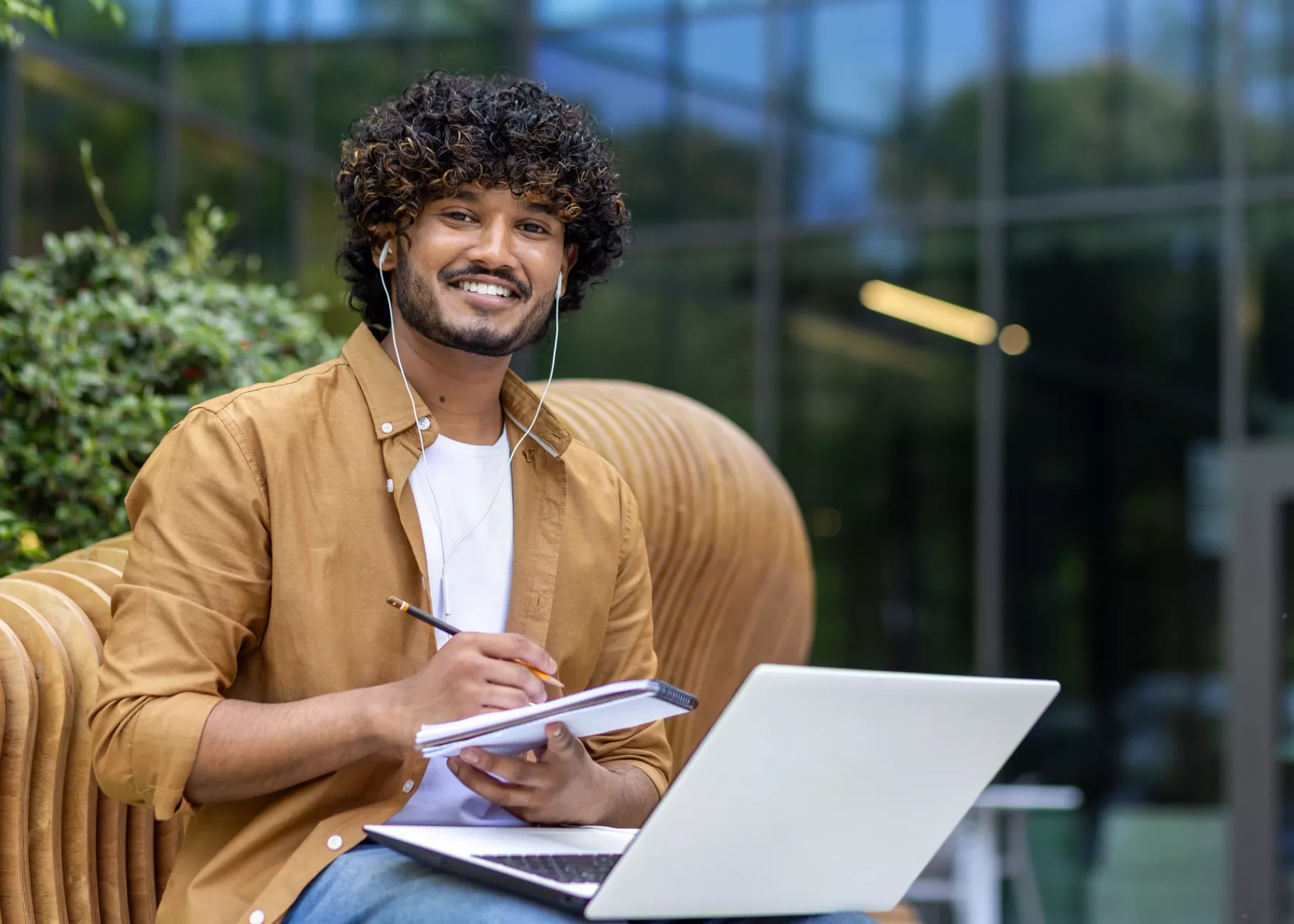 Young male student studying on a laptop