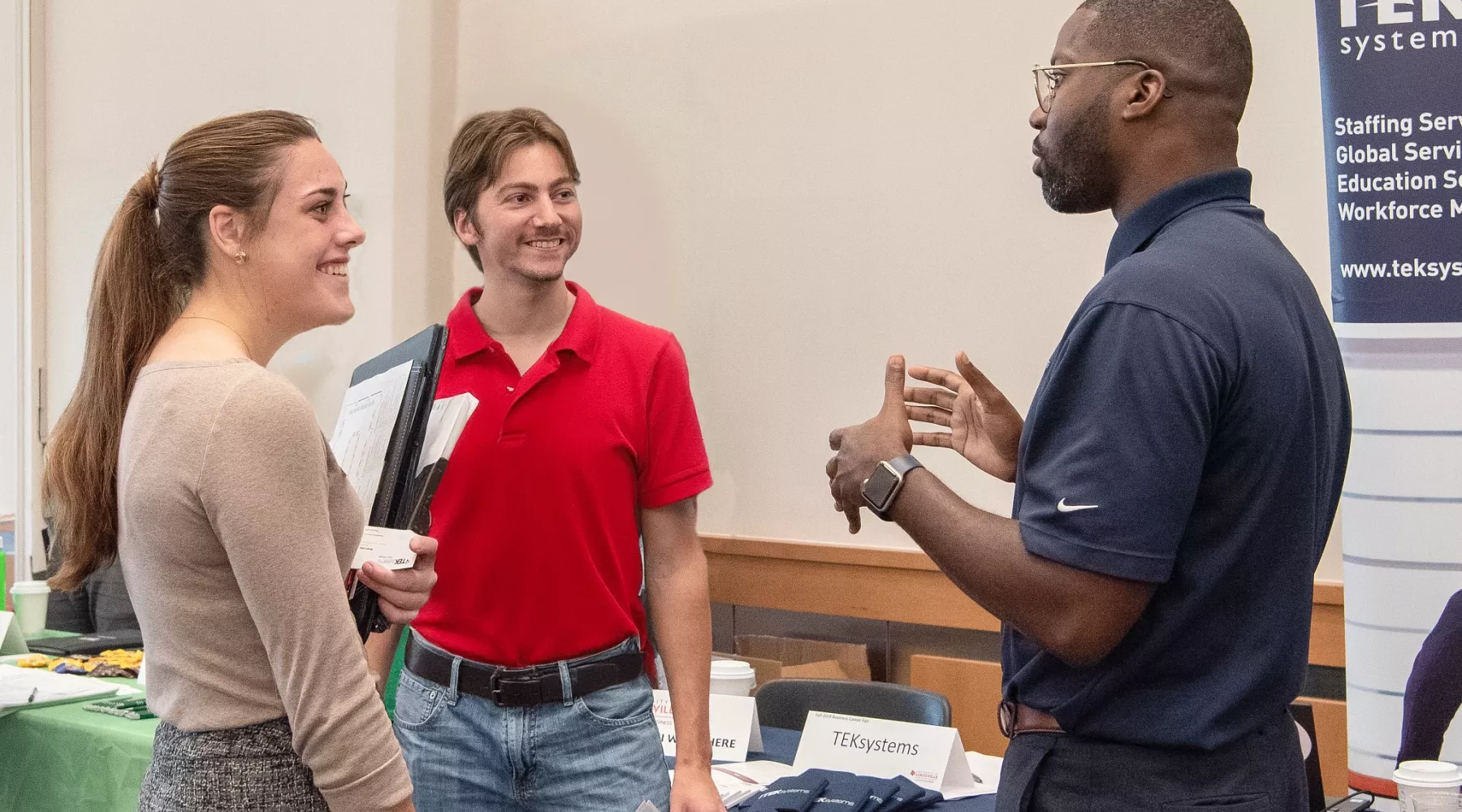Students talking to an employer at the Career Fair
