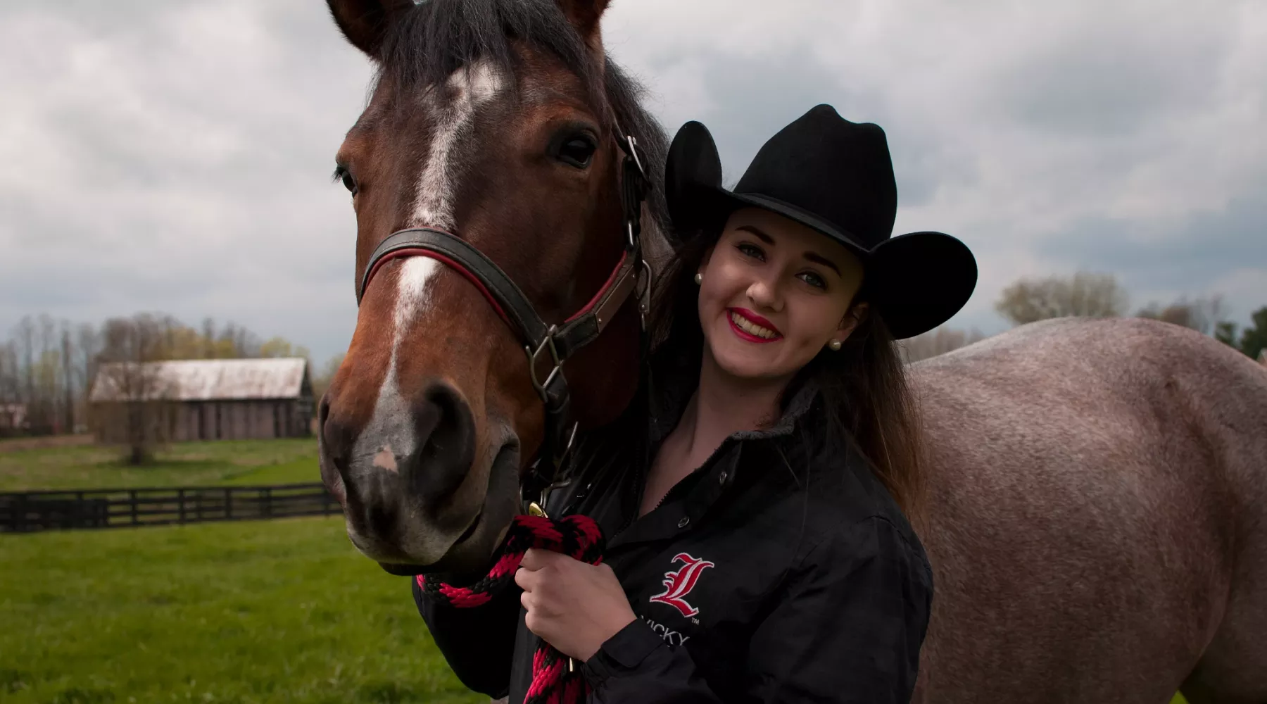 UofL College of Business student in her riding club uniform