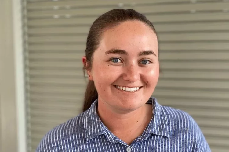 Headshot of a woman smiling.