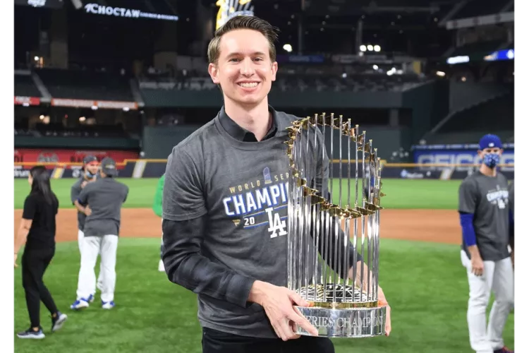 A man holding a trophy.