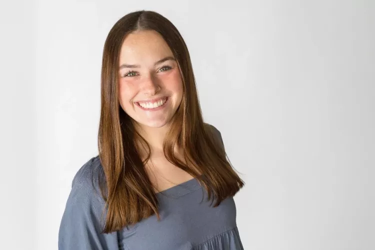 Outstanding Graduate, Kelsey Bruggeman, posing for photo