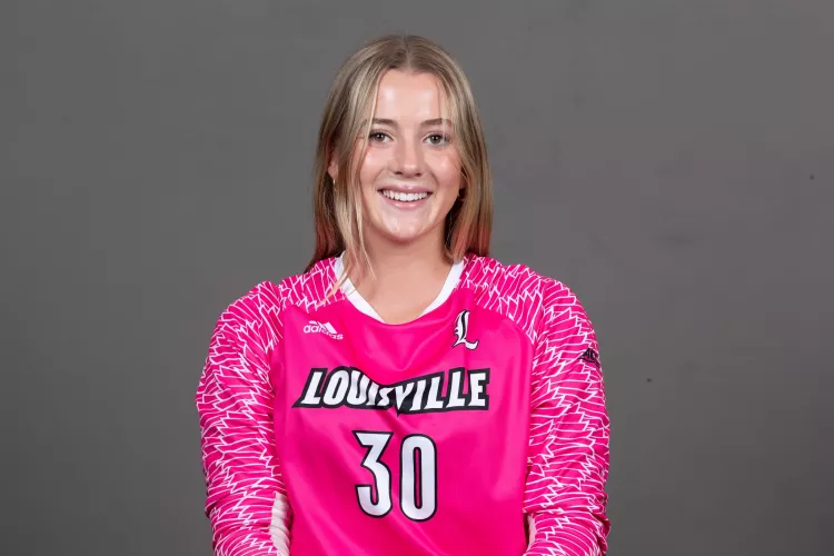 Erynn Floyd in pink UofL goalie jersey