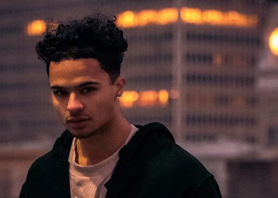 Headshot of a man outside at dusk.