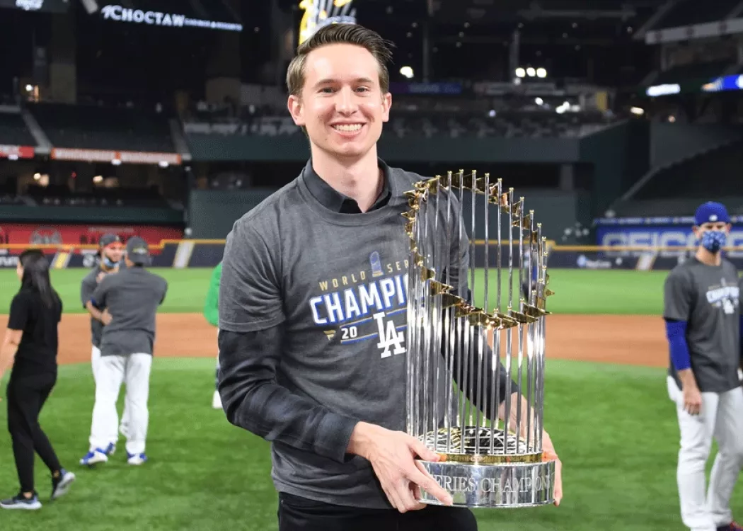 A man holding a trophy.