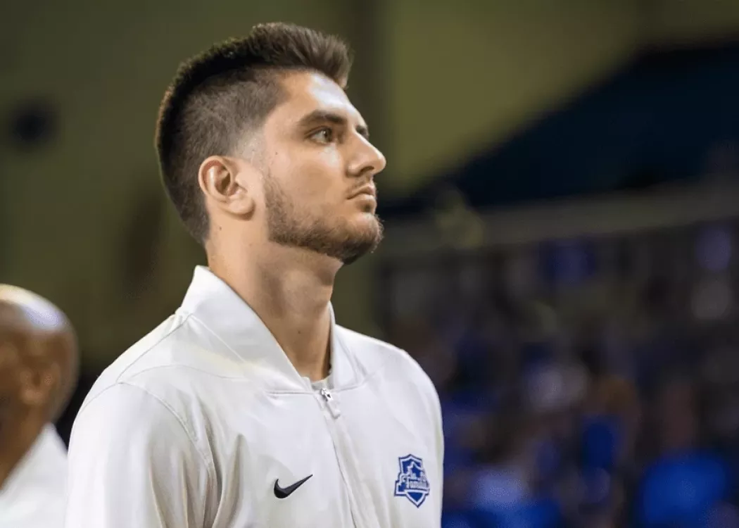 Ethan Coury on basketball court, focused