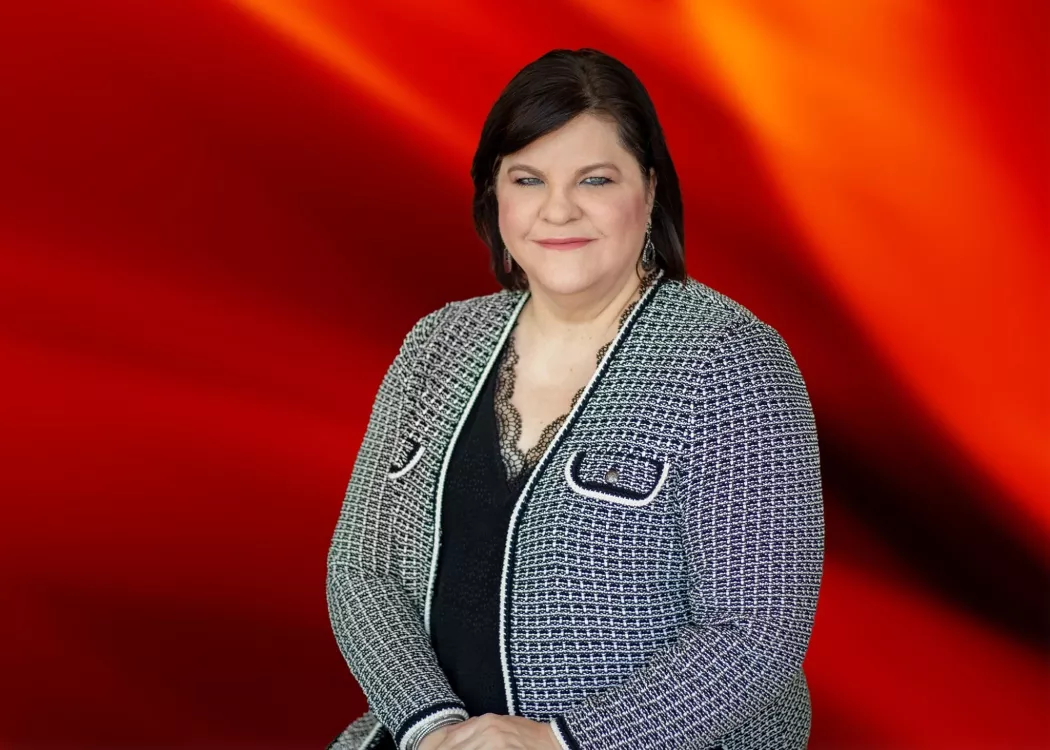 Dean Amy Henley on red essence background