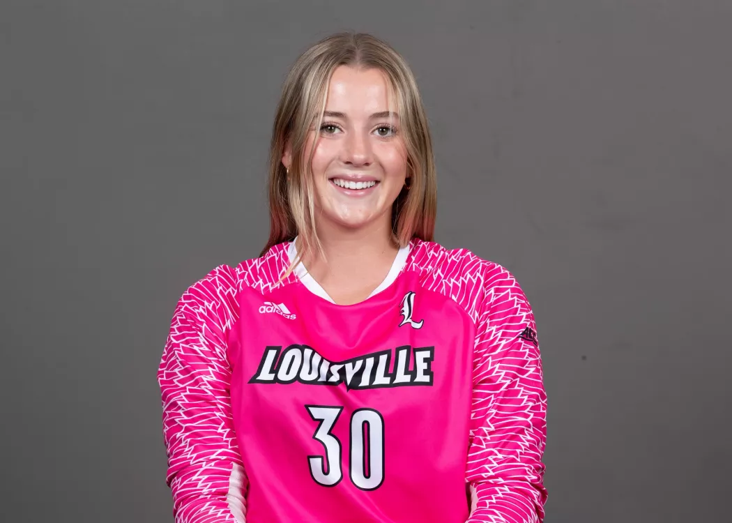 Erynn Floyd in pink UofL goalie jersey