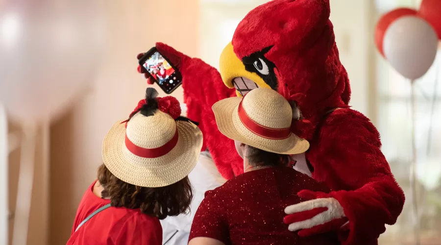 Louie takes a selfie with two women