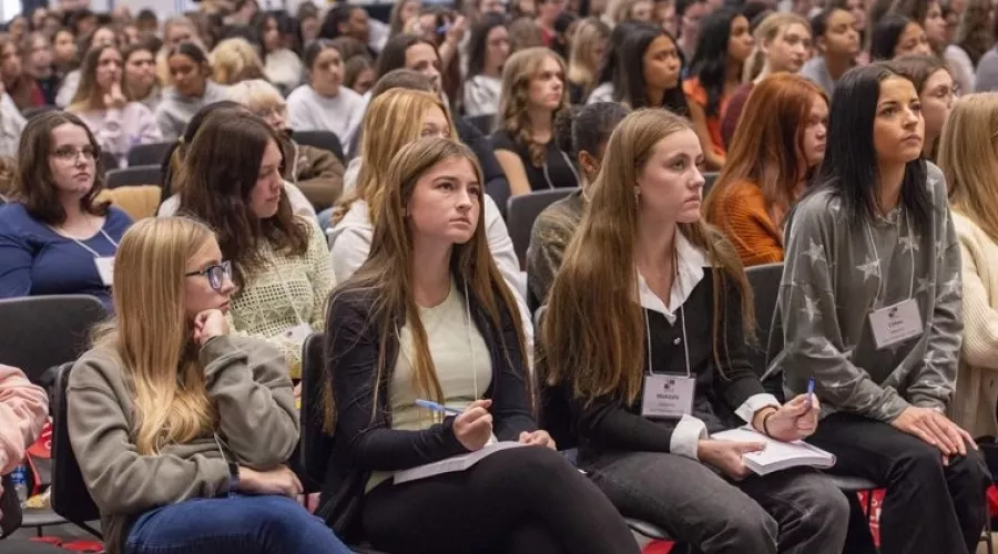 A large audience of women.
