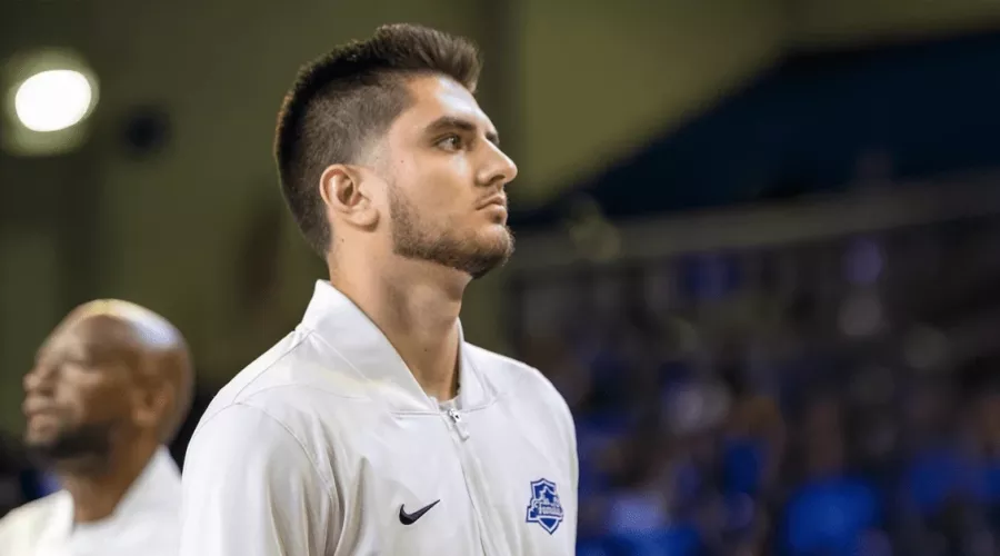 Ethan Coury on basketball court, focused