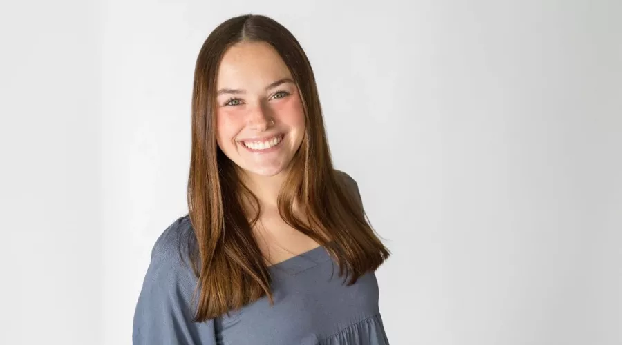 Outstanding Graduate, Kelsey Bruggeman, posing for photo