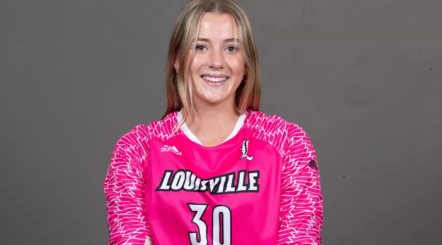 Erynn Floyd in pink UofL goalie jersey