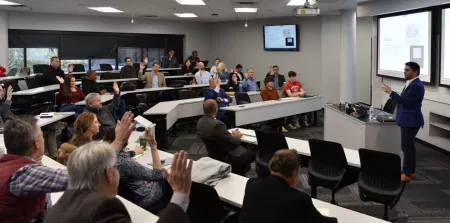 A man presenting to a classroom.