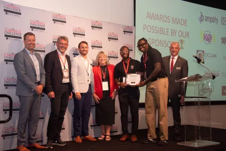 Cardinal Challenge group on stage receiving award.