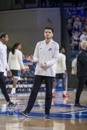Ethan Coury stands on the court at UK’s Rupp Arena during the 2025 La Familia TBT tournament