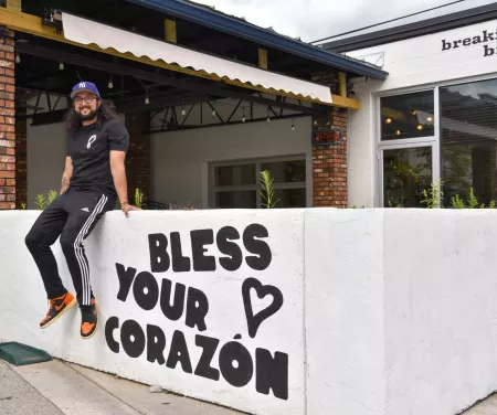 Co-Owner Joshua Gonzalez sits outside his restaurant, FOKO