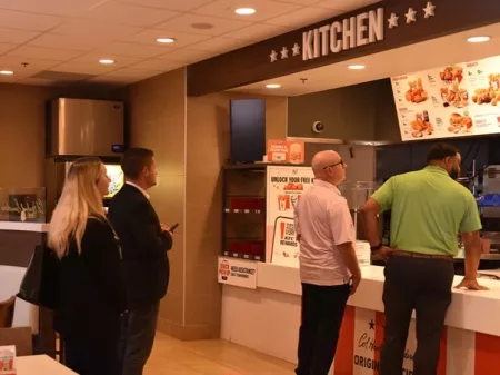 Accelerating Enterprise Growth attendees visit Yum! Brands headquarters, where they visit a fully-functioning Kentucky Fried…