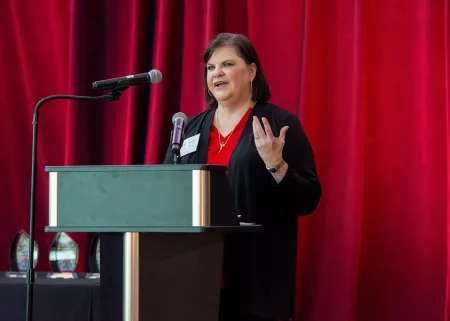Dean Amy Henley speaking at podium