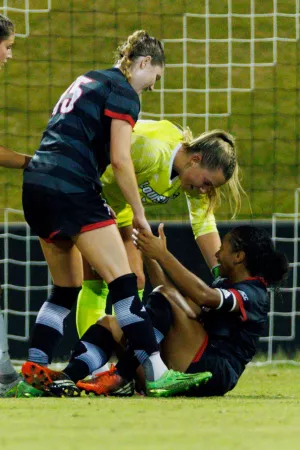 Hayley Howard, Ravin Alexander and Erynn Floyd celebrate a win after the game against Pitt at Lynn Stadium on September 21.