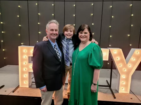 Family photo of Dean Amy Henley with husband David Cason and son Collier.